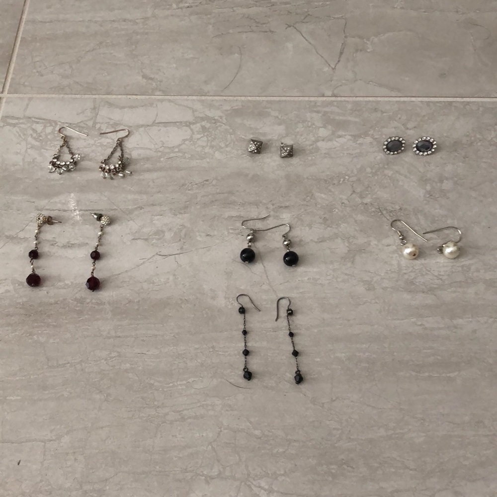 seven pairs of costume jewelry earrings